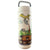 A white travel tumbler with a metal handle, featuring a whimsical illustration of a yellow dinosaur pouring tea from a teapot into the mouth of a green dinosaur.