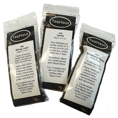 Three sample packages of TeaHaus tea with detailed descriptions.