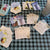 A spread of playing cards with tea-themed illustrations, various teas, and tea facts.
